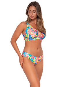 Side pose #1 of Taylor wearing Sunsets Shoreline Petals Alana Reversible Hipster Bottom with matching Vienna V-Wire bikini top