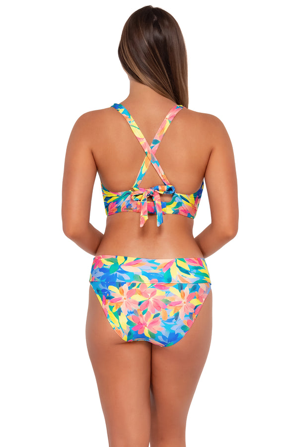Back pose #1 of Taylor wearing Sunsets Shoreline Petals Hannah High Waist Bottom showing folded waist with matching Vienna V-Wire bikini top