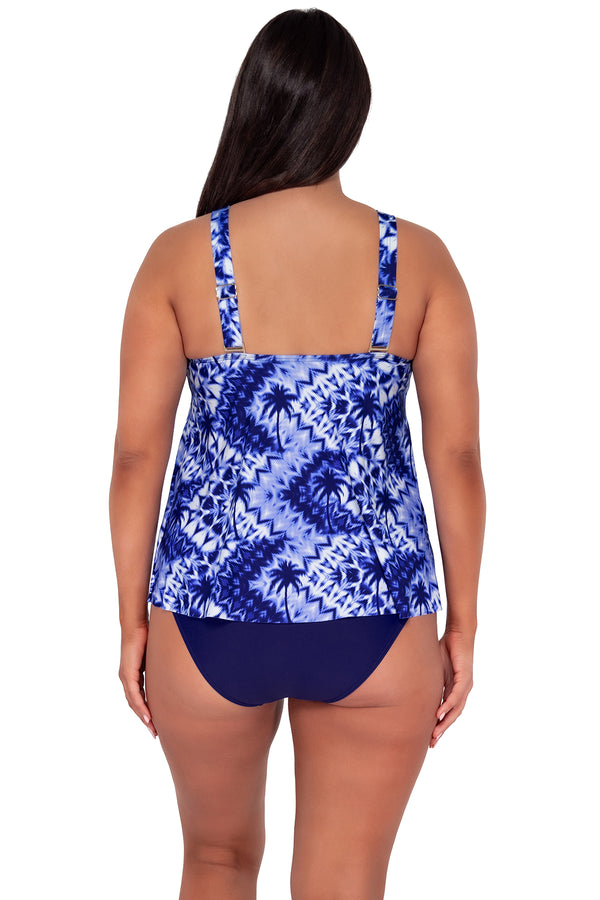 Back pose #1 of Nicki wearing Sunsets Escape Tulum Sadie Tankini Top paired with Indigo Hannah High Waist