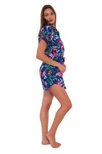 Side pose #1 of Daria wearing Sunsets Island Getaway Lucia Dress