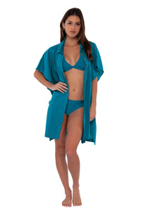 Front pose #1 of Gigi wearing Sunsets Avalon Teal Shore Thing Tunic as an open shirt