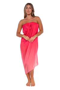 Front pose #1 of Taylor wearing Sunsets Geranium Paradise Pareo as a strapless swim cover-up