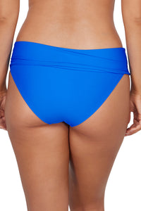 Back pose #1 of Taylor wearing Sunsets Electric Blue Capri High Waist Bottom showing folded waist