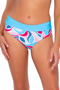 Front pose #1 of Daria wearing Sunsets Making Waves Capri High Waist Bottom showing folded waist .