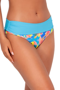 Side pose #2 of Taylor wearing Sunsets Shoreline Petals Capri High Waist Bottom showing folded waist .