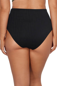 Back pose #1 of Taylor wearing Sunsets Venice Seagrass Texture Capri High Waist Bottom