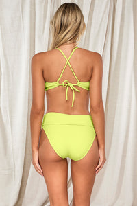 Back pose #1 of Jessica wearing Pacifica Bright Pear Hannah High Waist Bottom showing folded waist paired with matching