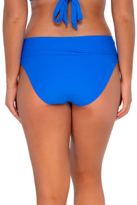 Back pose #1 of Taylor wearing Sunsets Electric Blue Hannah High Waist Bottom showing folded waist