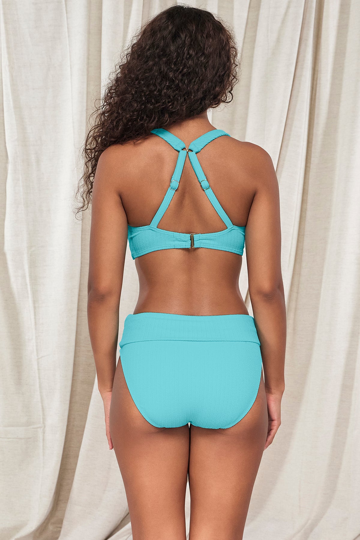 Back pose #1 of Jasmine wearing Pacifica Pool Party Hannah High Waist Bottom showing crossback straps paired with matching