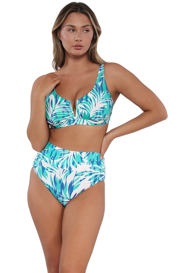 Active pose #1 of Taylor wearing Sunsets Sea Breeze Sandbar Rib Hannah High Waist Bottom paired with matching