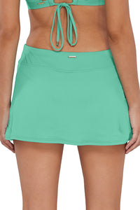 Back pose #1 of Jessica wearing Sunsets Aqua Mist Sandbar Rib Sporty Swim Skirt