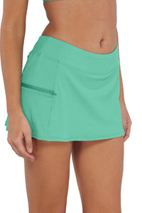 Quarter pose #1 of Jessica wearing Sunsets Aqua Mist Sandbar Rib Sporty Swim Skirt