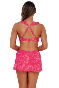 Back pose #1 of Taylor wearing Sunsets Blushing Palms Sandbar Rib Sporty Swim Skirt paired with matching