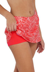 Quarter pose #1 of Jessica wearing Sunsets Majorca Sporty Swim Skirt lifted to show attached swim short