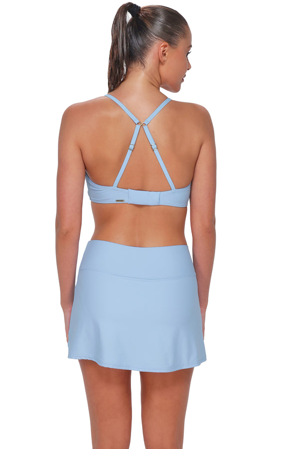 Back pose #1 of Daniella wearing Sunsets Blue Whisper Allison Swim Skirt