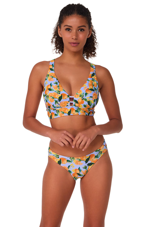 Active pose #1 of Brita wearing Sunsets Clementine Natalie Top