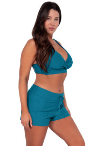 Side pose #1 of Nicki wearing Sunsets Avalon Teal Elsie Top paired with Laguna Swim Short women's casual wear