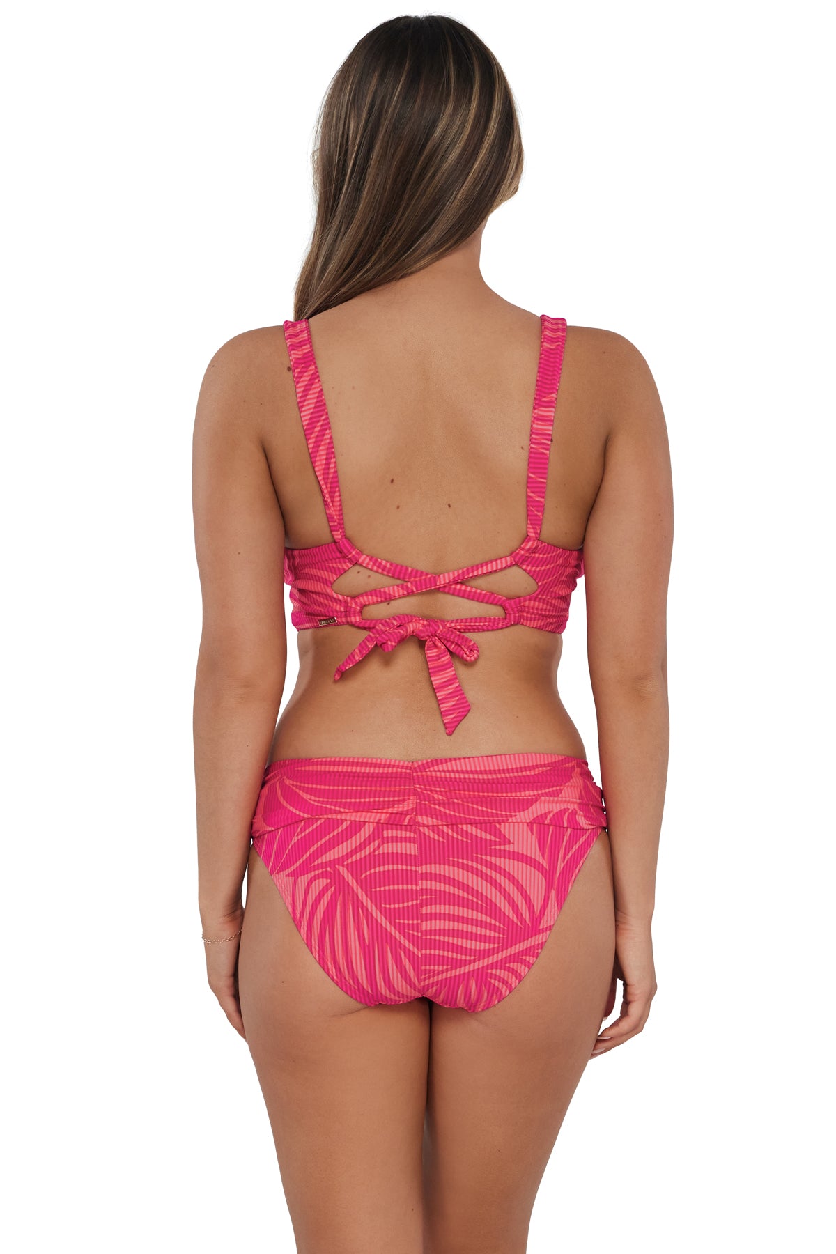 Back pose #1 of Taylor wearing Sunsets Blushing Palms Sandbar Rib Elsie Top