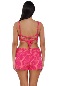 Back pose #1 of Nicki wearing Sunsets Escape Blushing Palms Sandbar Rib Laguna Swim Short paired with matching