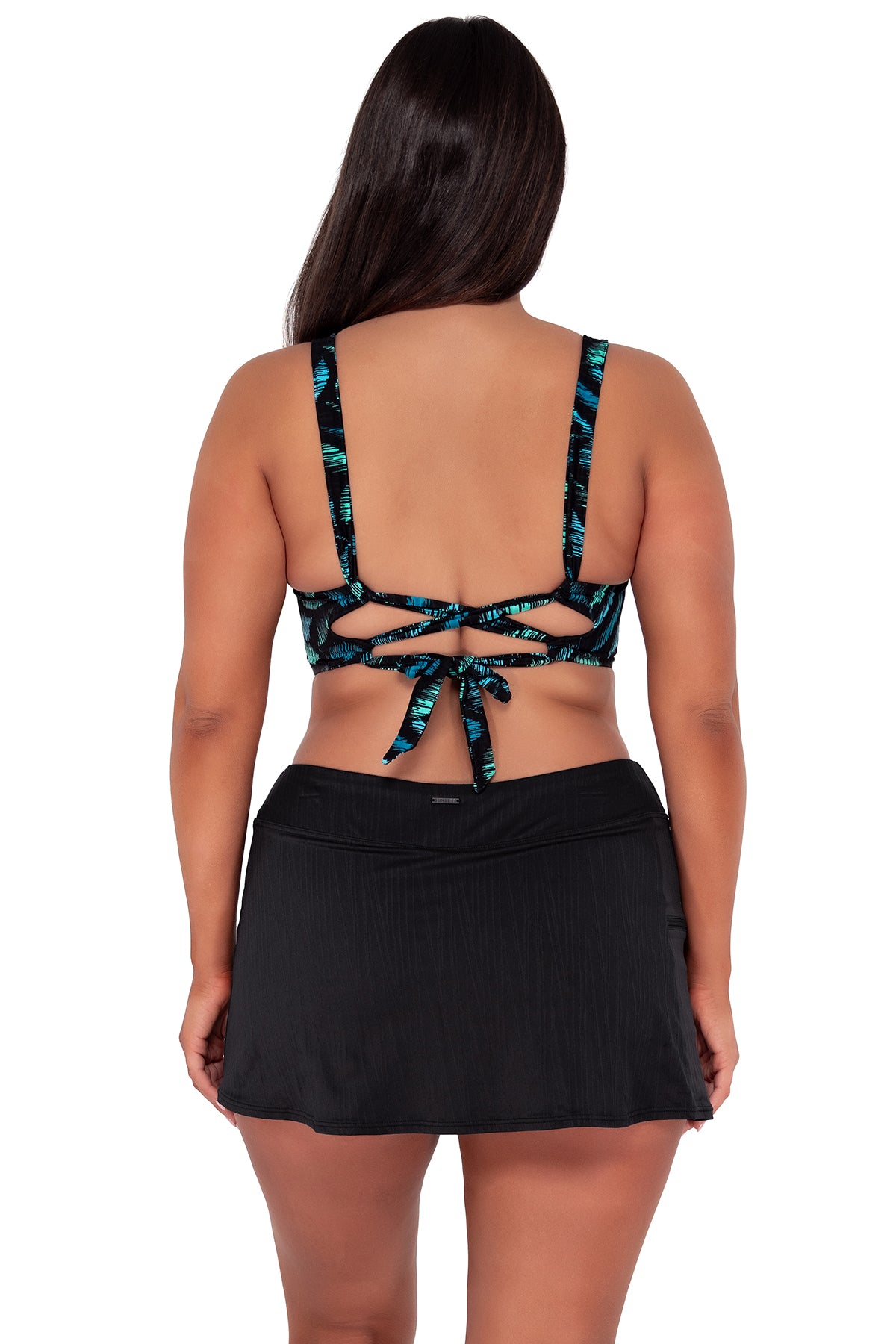 Back pose #1 of Nicki wearing Sunsets Cascade Seagrass Texture Elsie Top paired with Sporty Swim Skirt swim bottom