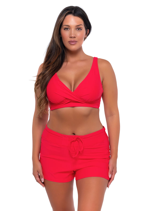 Front Front pose #1 of Nicky wearing Sunsets Escape Geranium Laguna Swim Short with matching Elsie Top underwire bikini