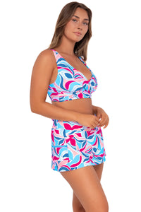 Side pose #1 of Taylor wearing Sunsets Making Waves Sporty Swim Skirt with matching Elsie Top bikini bralette