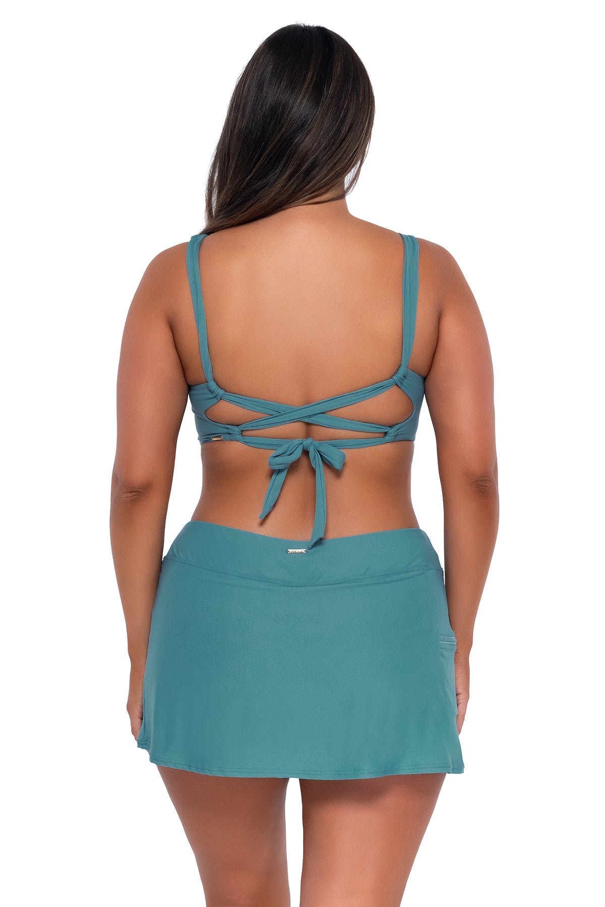 Back pose #1 of Taylor wearing Sunsets Ocean Sporty Swim Skirt with matching Elsie Top underwire bikini