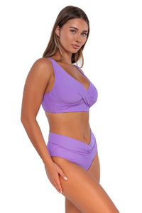 Side pose #1 of Taylor wearing Sunsets Passion Flower Summer Lovin V-Front Bottom with matching Elsie Top underwire bikini