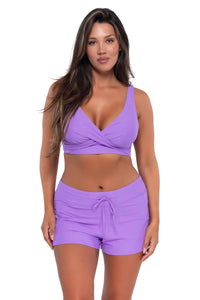 Front pose #1 of Nicky wearing Sunsets Escape Passion Flower Laguna Swim Short with matching Elsie Top underwire bikini