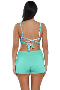 Back pose #1 of Nicki wearing Sunsets Sea Breeze Sandbar Rib Elsie Top