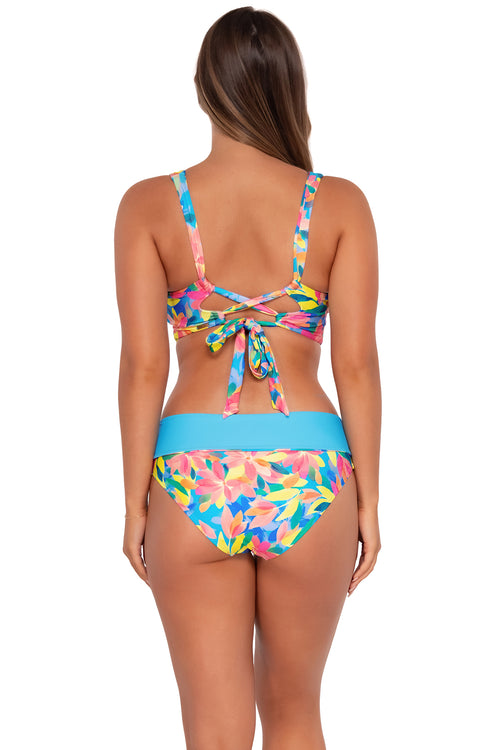 Back pose #1 of Taylor wearing Sunsets Shoreline Petals Capri High Waist Bottom showing folded waist with matching Elsie Top bikini bralette .