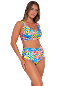 Side pose #1 of Taylor wearing Sunsets Shoreline Petals Elsie Top with matching Capri High Waist bikini bottom