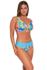 Side pose #2 of Taylor wearing Sunsets Shoreline Petals Capri High Waist Bottom showing folded waist with matching Elsie Top bikini bralette .