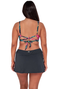 Back pose #1 of Nicki wearing Sunsets Twilight Blooms Elsie Top paired with Sporty Swim Skirt swim bottom
