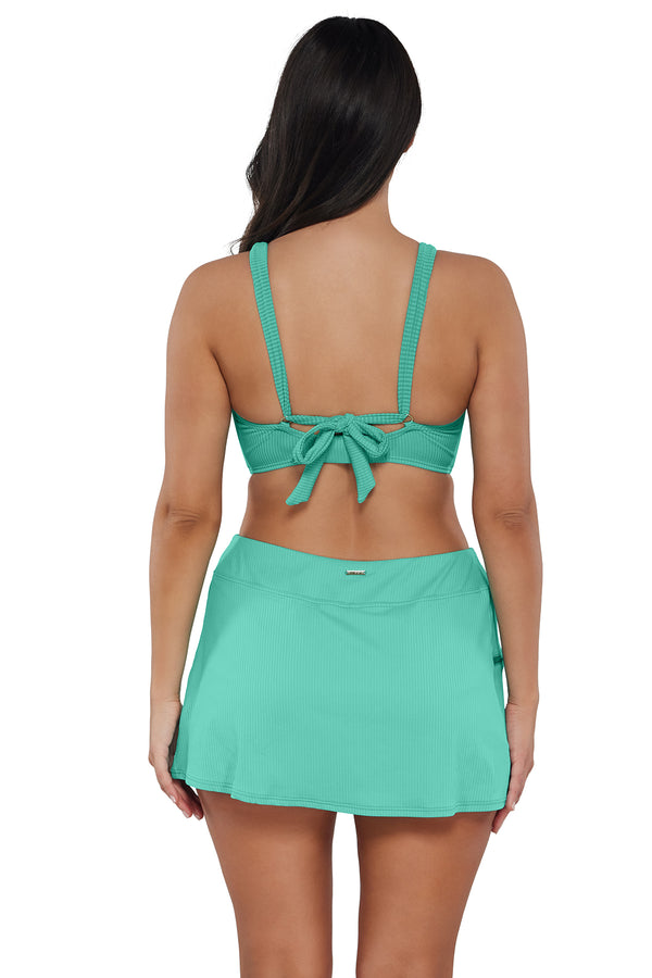 Back pose #1 of Nicki wearing Sunsets Aqua Mist Sandbar Rib Vienna V-Wire Top paired with matching Bikini Bottom