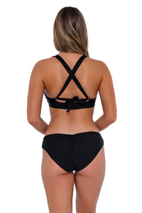 Back pose #1 of Taylor wearing Sunsets Black Vienna V-Wire Top showing crossback straps with matching Alana Reversible Hipster bikini bottom