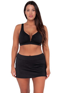 Front pose #1 of Nicki wearing Sunsets Black Seagrass Texture Vienna V-Wire Top paired with Sporty Swim Skirt swim bottom