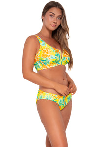 Side pose #1 of Taylor wearing Sunsets Golden Tropics Sandbar Rib Vienna V-Wire Top showing over-the-shoulder tie with matching Alana Reversible Hipster bikini bottom