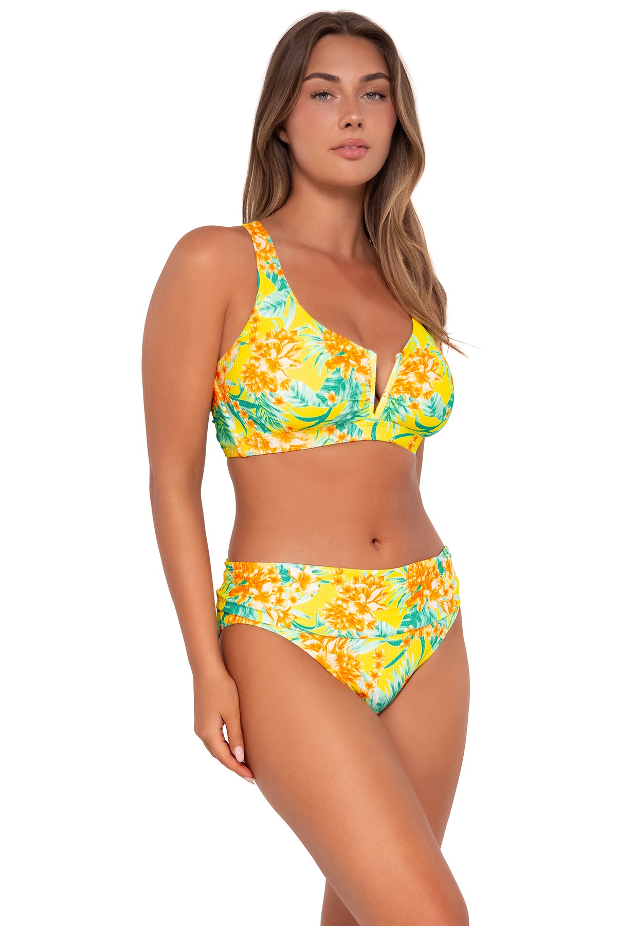 Side pose #1 of Taylor wearing Sunsets Golden Tropics Sandbar Rib Unforgettable Bottom with matching Vienna V-Wire bikini top