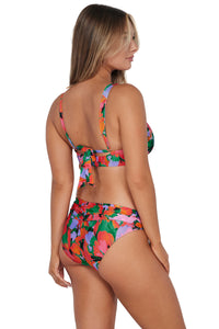 Oblique pose #1 of Taylor wearing Sunsets Hummingbird Cove Unforgettable Bottom paired with matching Elsie Bikini Top