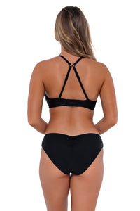 Back pose #1 of Taylor wearing Sunsets Black Kauai Keyhole Top showing crossback straps with matching Alana Reversible Hipster bikini bottom