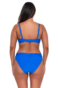 Back pose #1 of Nicky wearing Sunsets Electric Blue Kauai Keyhole Top with matching Unforgettable Bottom bikini