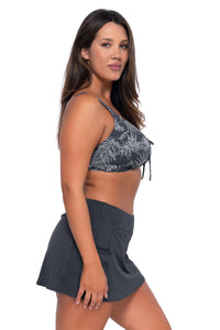 Side pose #1 of Nicky wearing Sunsets Fanfare Seagrass Texture Kauai Keyhole Top with matching Sporty Swim Skirt