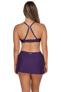 Back pose #1 of Taylor wearing Sunsets Paradise Plum Sporty Swim Skirt Bottom paired with matching Kauai Keyhole Bikini Top