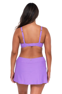 Back pose #1 of Nicky wearing Sunsets Passion Flower Kauai Keyhole Top with matching Sporty Swim Skirt