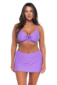 Front pose #1 of Nicky wearing Sunsets Passion Flower Kauai Keyhole Top with matching Sporty Swim Skirt