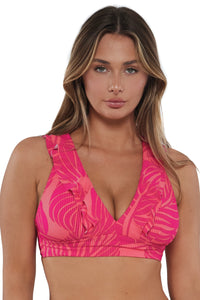 Front pose #1 of Taylor wearing Sunsets Blushing Palms Sandbar Rib Willa Wireless Top