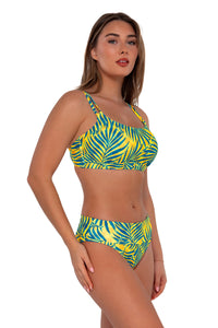 Side pose #1 of Taylor wearing Sunsets Cabana Taylor Bralette Top with matching Hannah High Waist bikini bottom showing folded waist