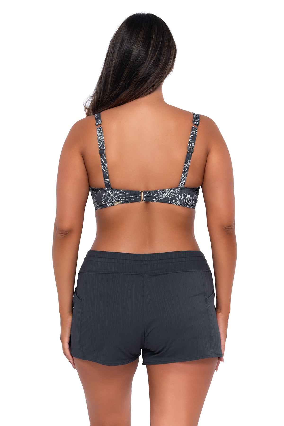 Back pose #1 of Nicky wearing Sunsets Fanfare Seagrass Texture Taylor Bralette Top with matching Laguna Swim Short