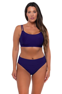 Front pose #1 of Nicky wearing Sunsets Indigo Taylor Bralette Top with matching Hannah High Waist bikini bottom